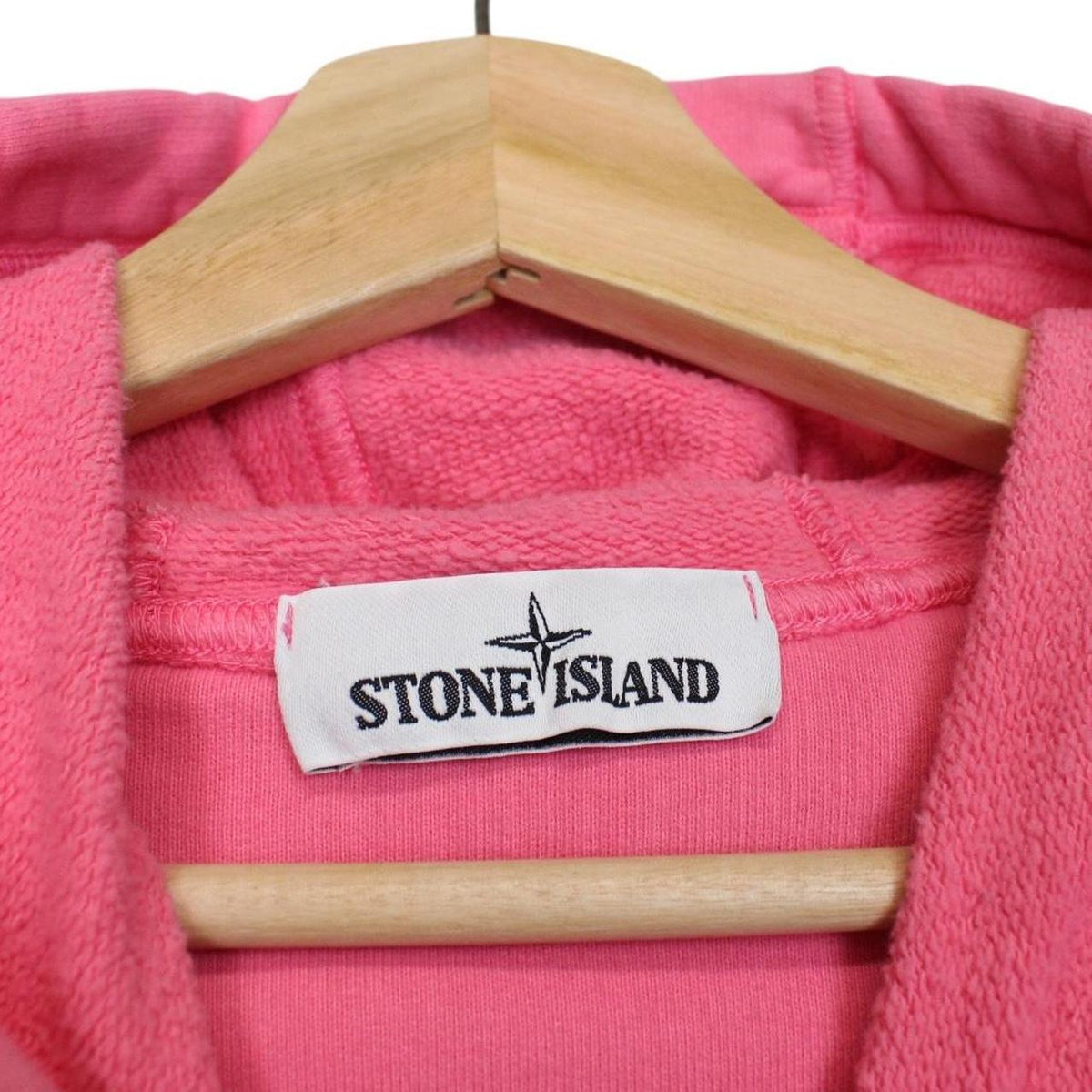 Stone Island pink hoodie jumper with iconic compass logo and soft cotton material.