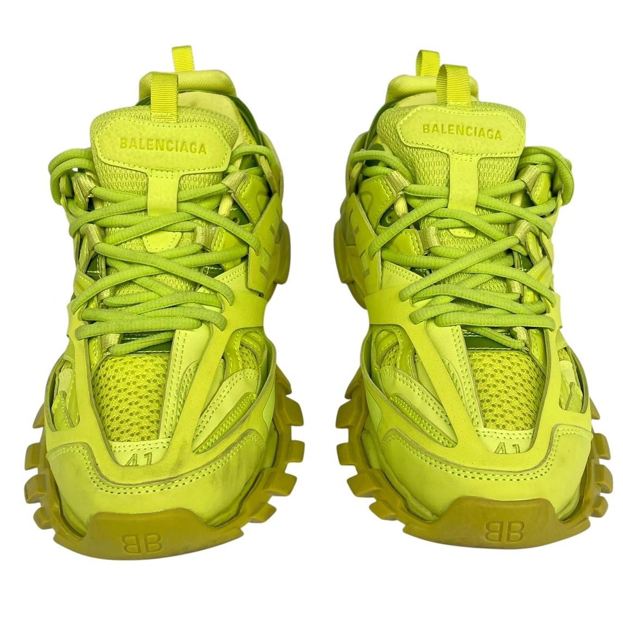 Balenciaga green low top trainers with logo detailing and textured mesh upper.