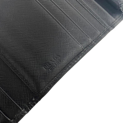 Prada black bifold wallet Saffiano leather with logo embossed detail.