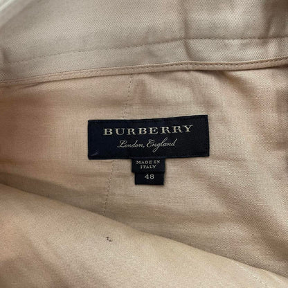Burberry beige tapered fit trousers with sketch print design and cotton material.