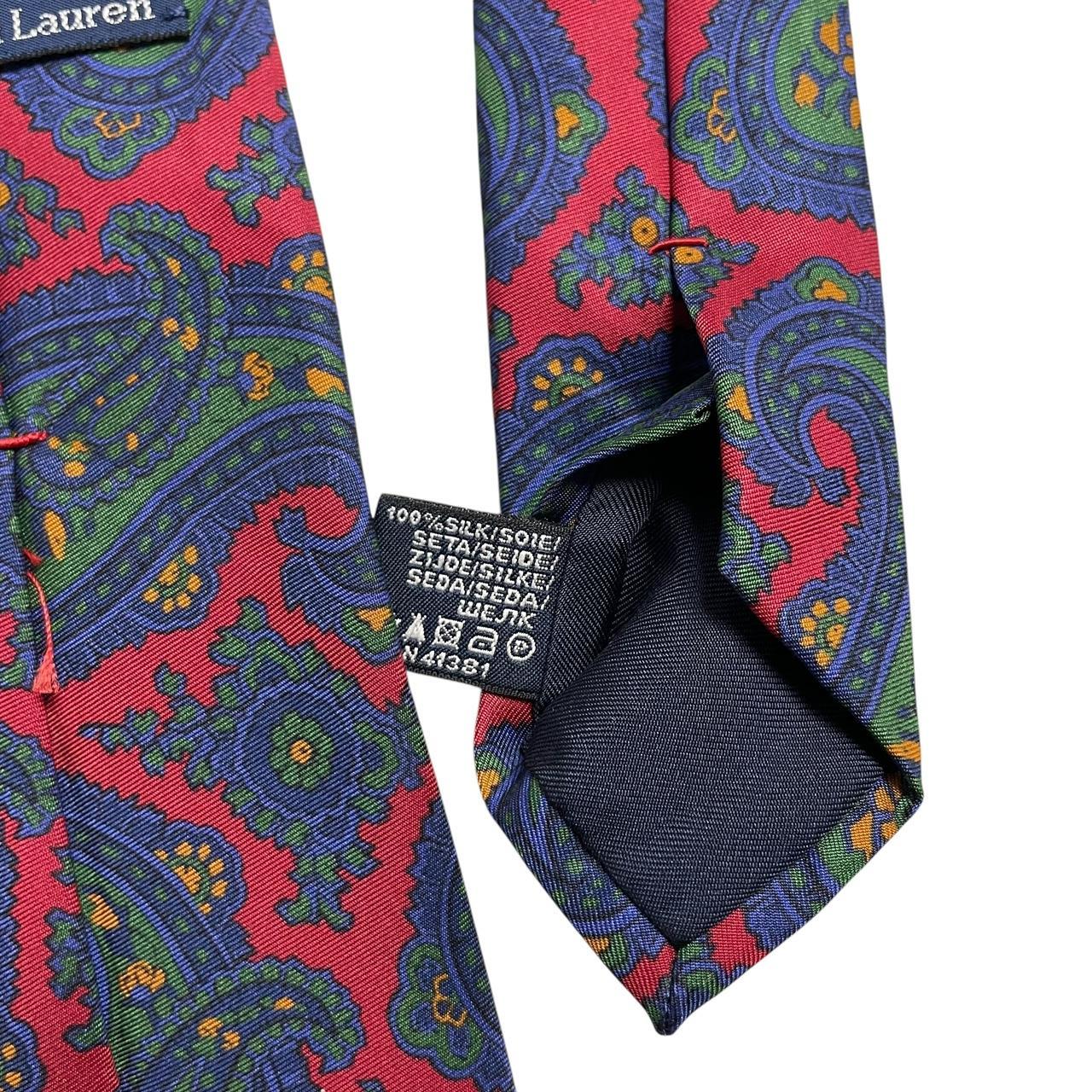 Polo Ralph Lauren multicoloured paisley print silk tie with vibrant patterns and luxurious texture.