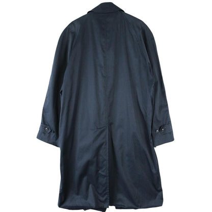 Christian Dior navy blue trench coat, single-breasted, vintage 90s style, classic design.