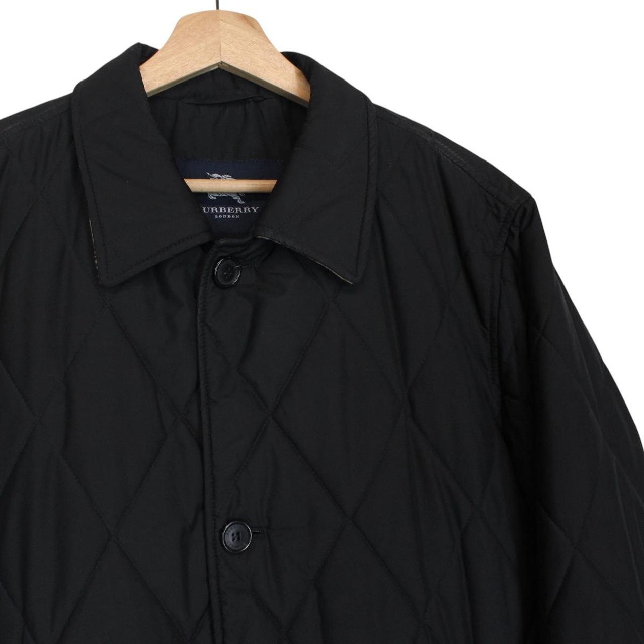 Burberry black coat with Nova Check lining and diamond quilted pattern.