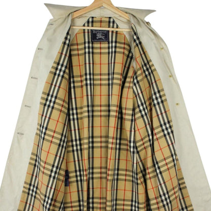 Burberry beige trench coat featuring iconic Nova Check pattern and single breasted design.