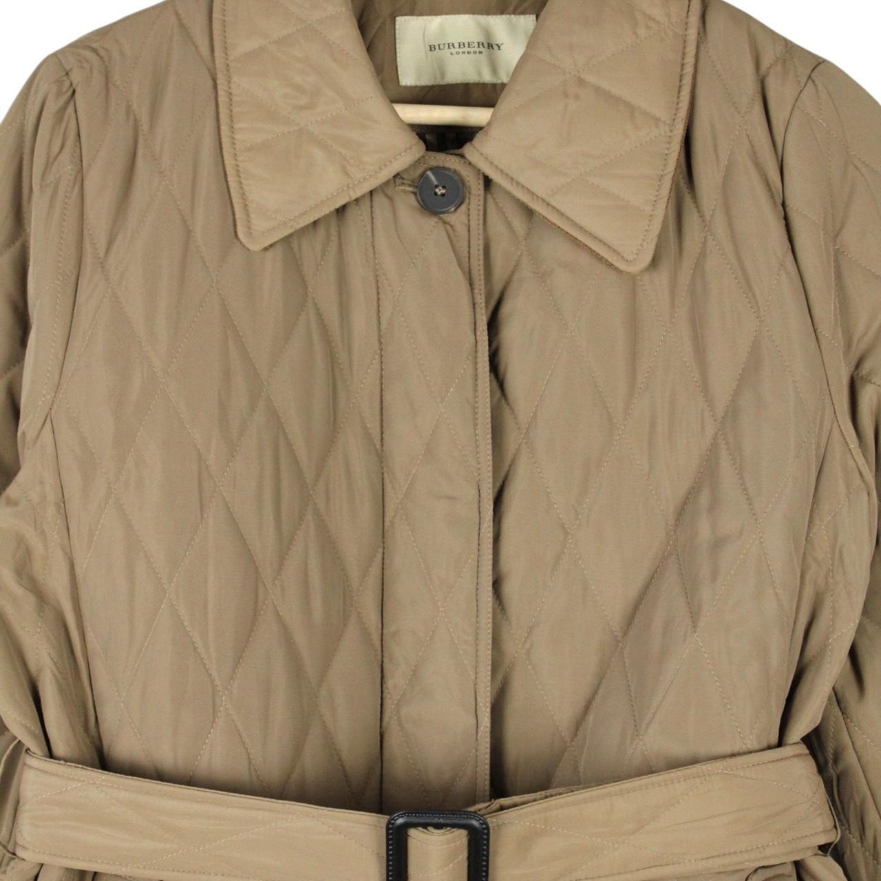 Burberry tan brown belted coat with diamond quilted pattern and logo detailing.
