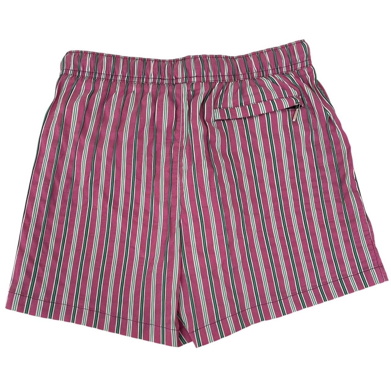 Paul Smith red swim shorts with striped pattern and cotton material.
