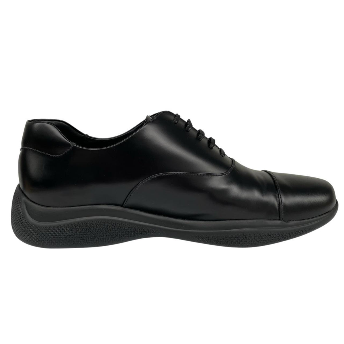 Prada black leather laced derby loafers with subtle signs of wear, includes original dust bags.