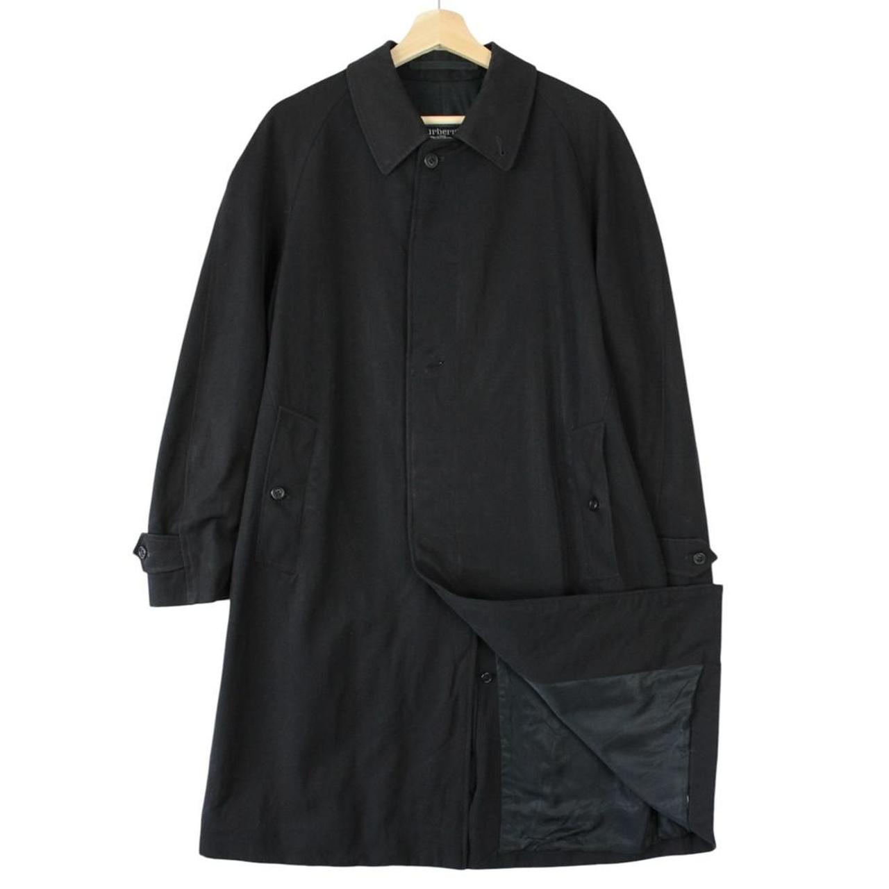 Burberry navy blue wool trench coat with single breasted design and classic logo.