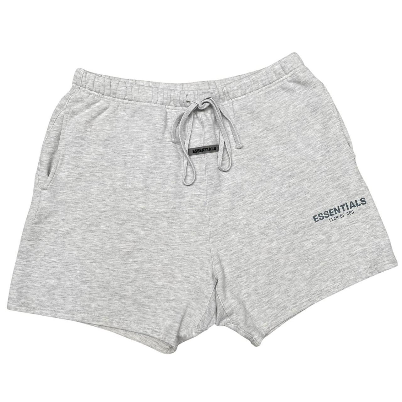 Essentials grey jogger shorts cotton material with logo detail and relaxed fit.