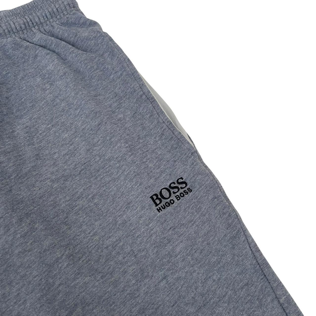 Hugo Boss blue jogger shorts with elastic waistband and logo detail.
