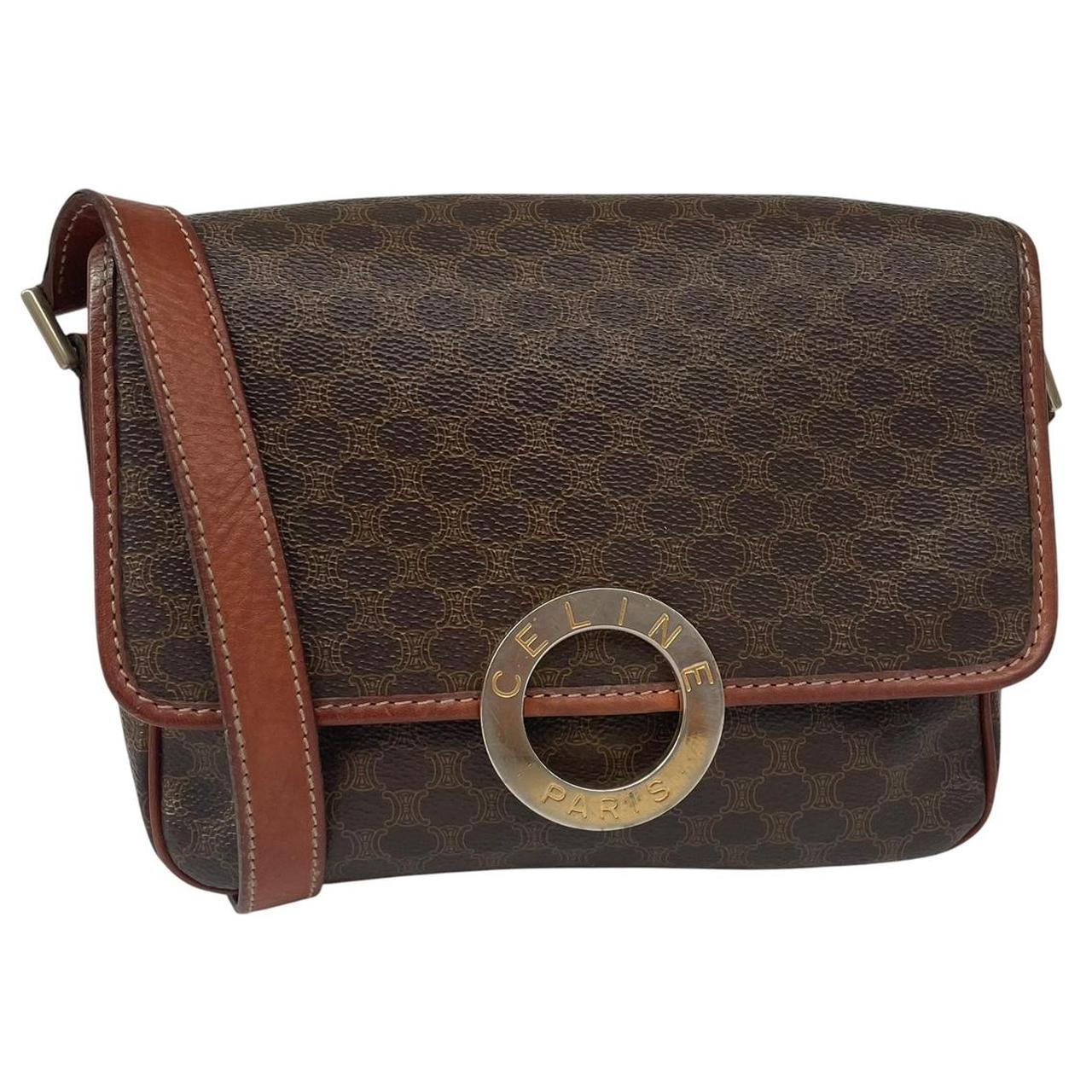CELINE brown duffel bag with Macadam canvas pattern and logo detail.