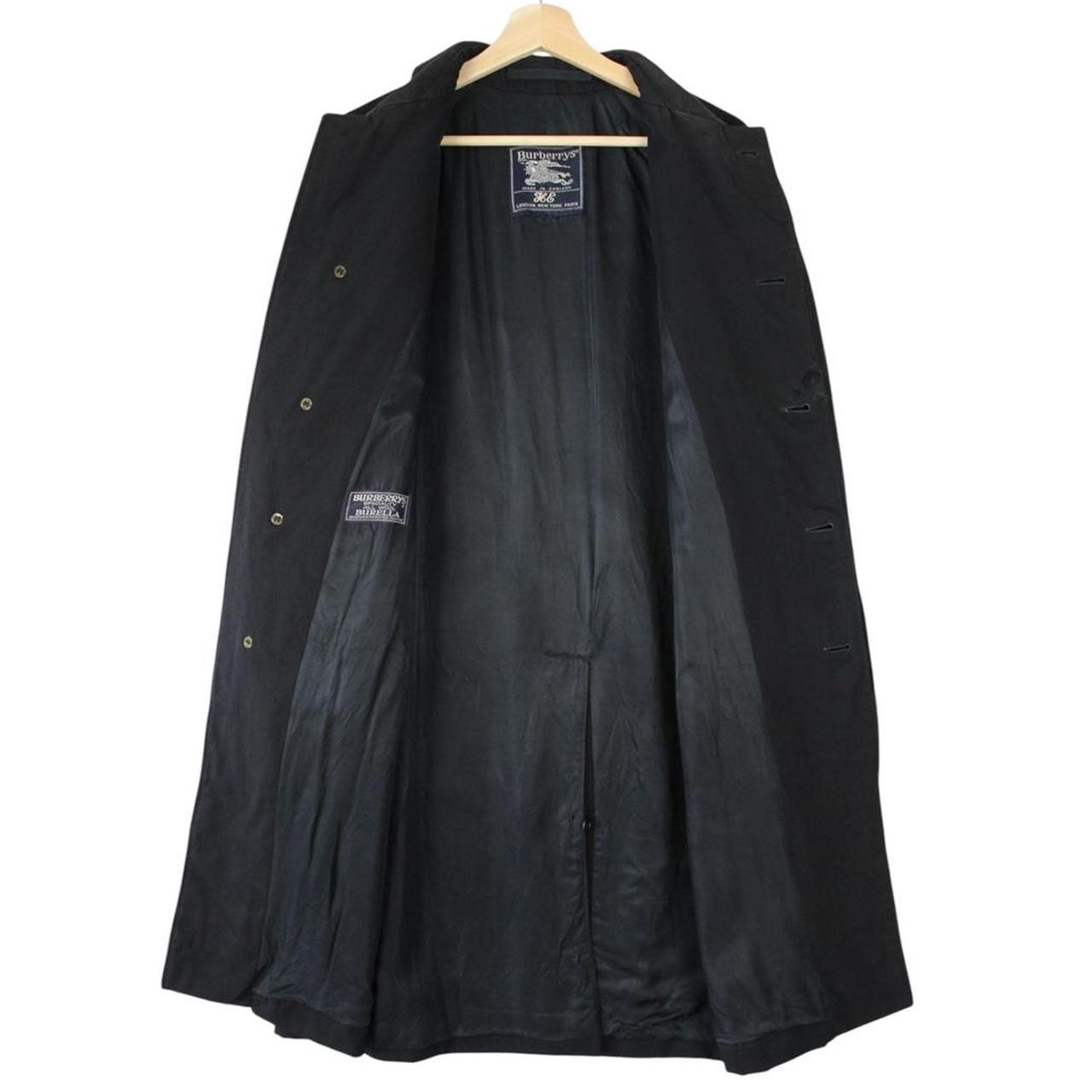 Burberry navy blue wool trench coat with single breasted design and classic logo.