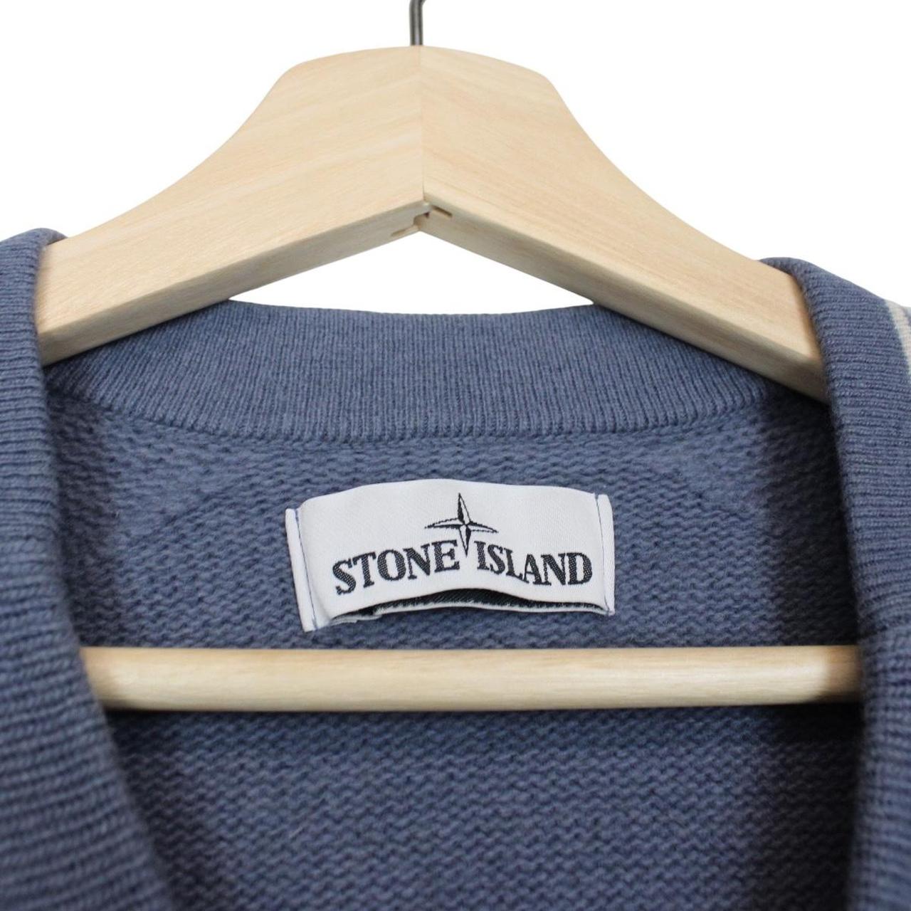 Stone Island blue wool knit jumper with logo patch and ribbed cuffs.