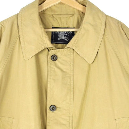 Burberry beige coat with Nova Check pattern, multi pockets, and cream lining.