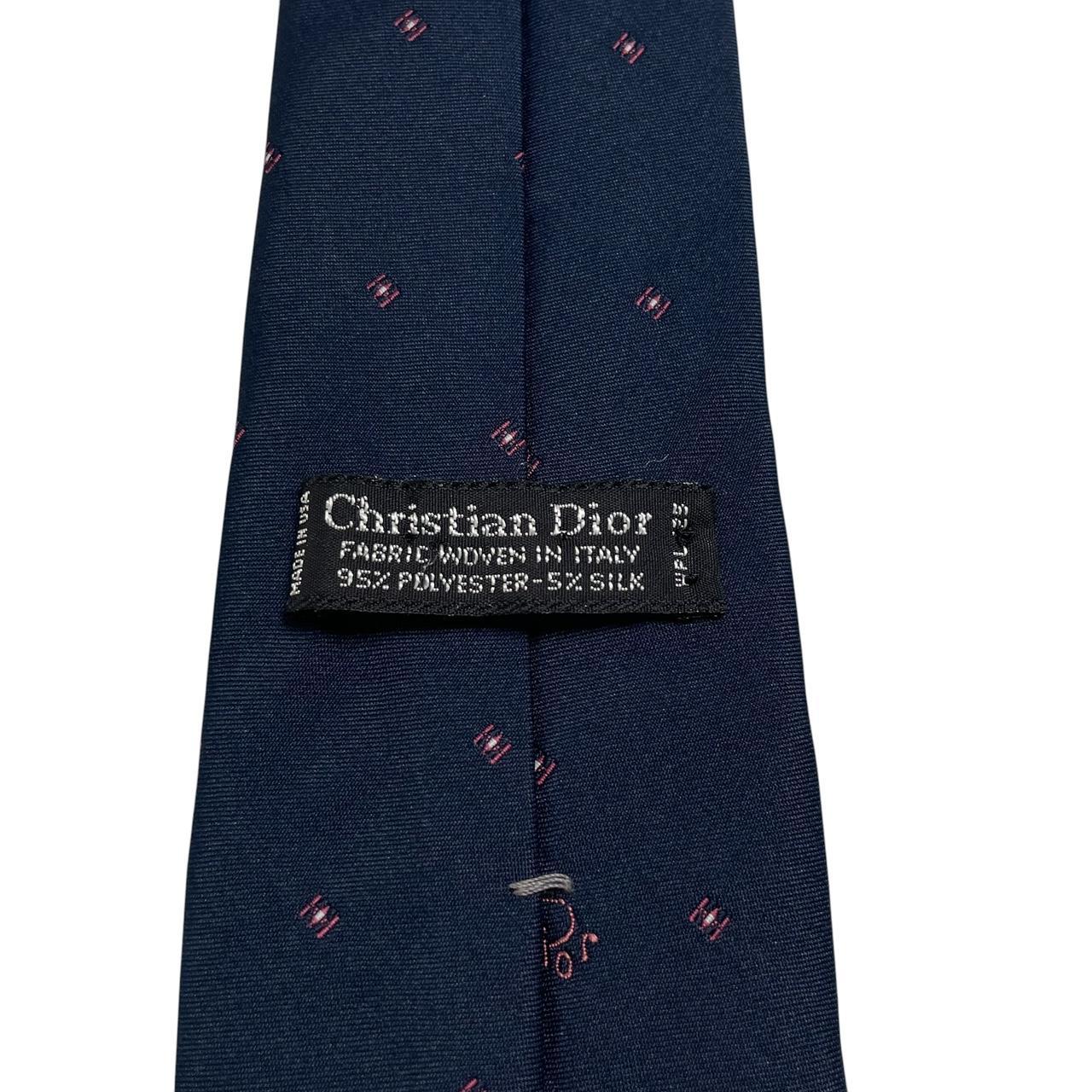 Christian Dior navy blue tie with silk blend, featuring subtle sheen and classic design.