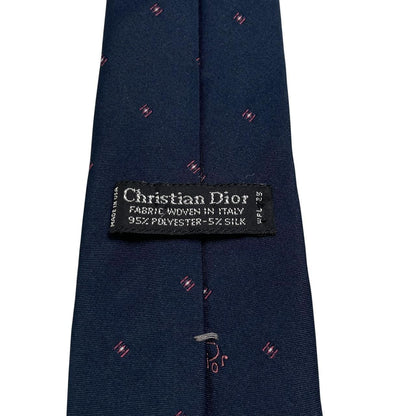 Christian Dior navy blue tie with silk blend, featuring subtle sheen and classic design.