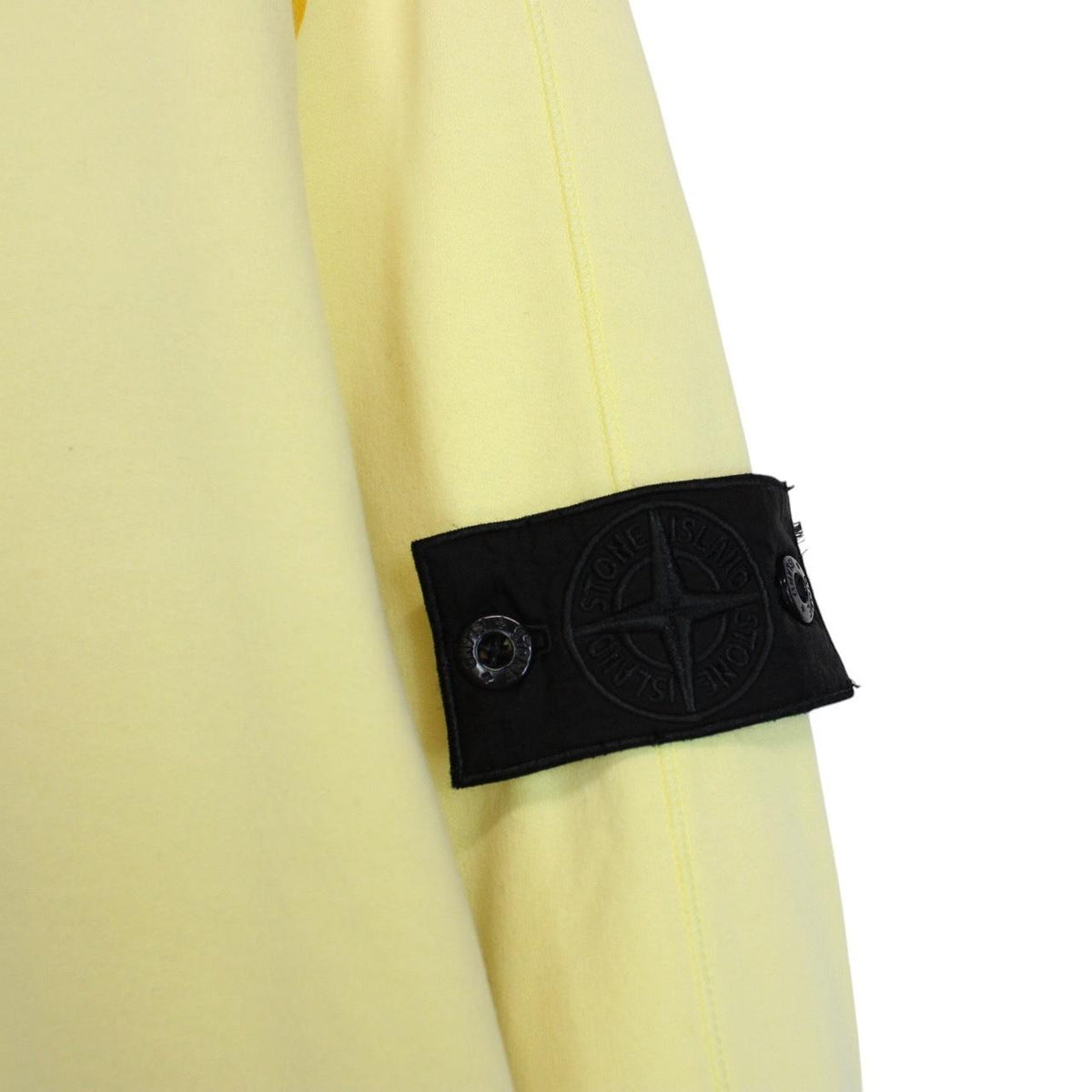 Stone Island yellow v-neck sweatshirt with logo patch and soft cotton material.
