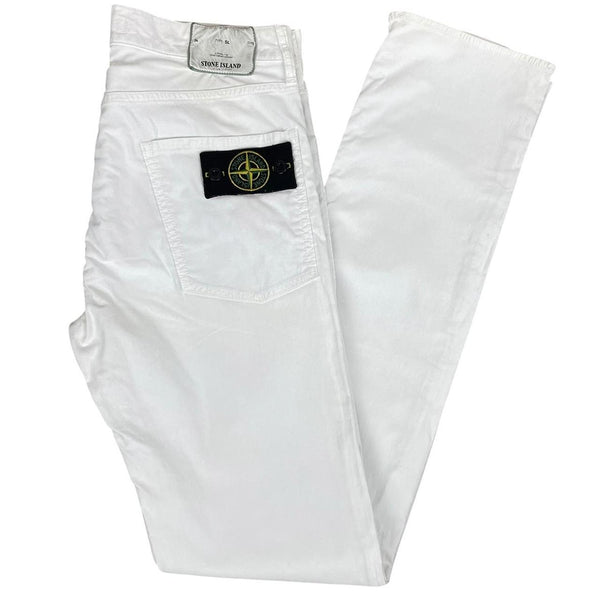 Stone Island white slim fit cotton trousers with logo patch and front mark.
