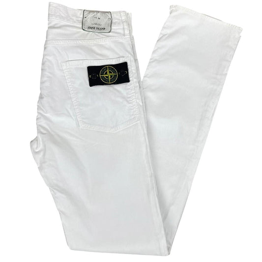 Stone Island white slim fit cotton trousers with logo patch and front mark.