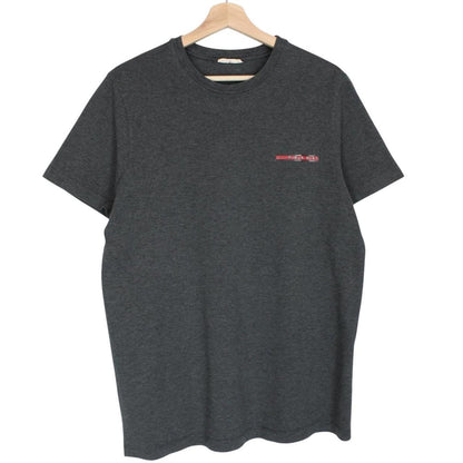 Prada grey cotton t-shirt with red logo and pocket detail, vintage style.