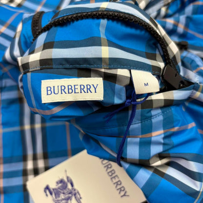 Burberry reversible windbreaker jacket in blue and black with Nova Check pattern.