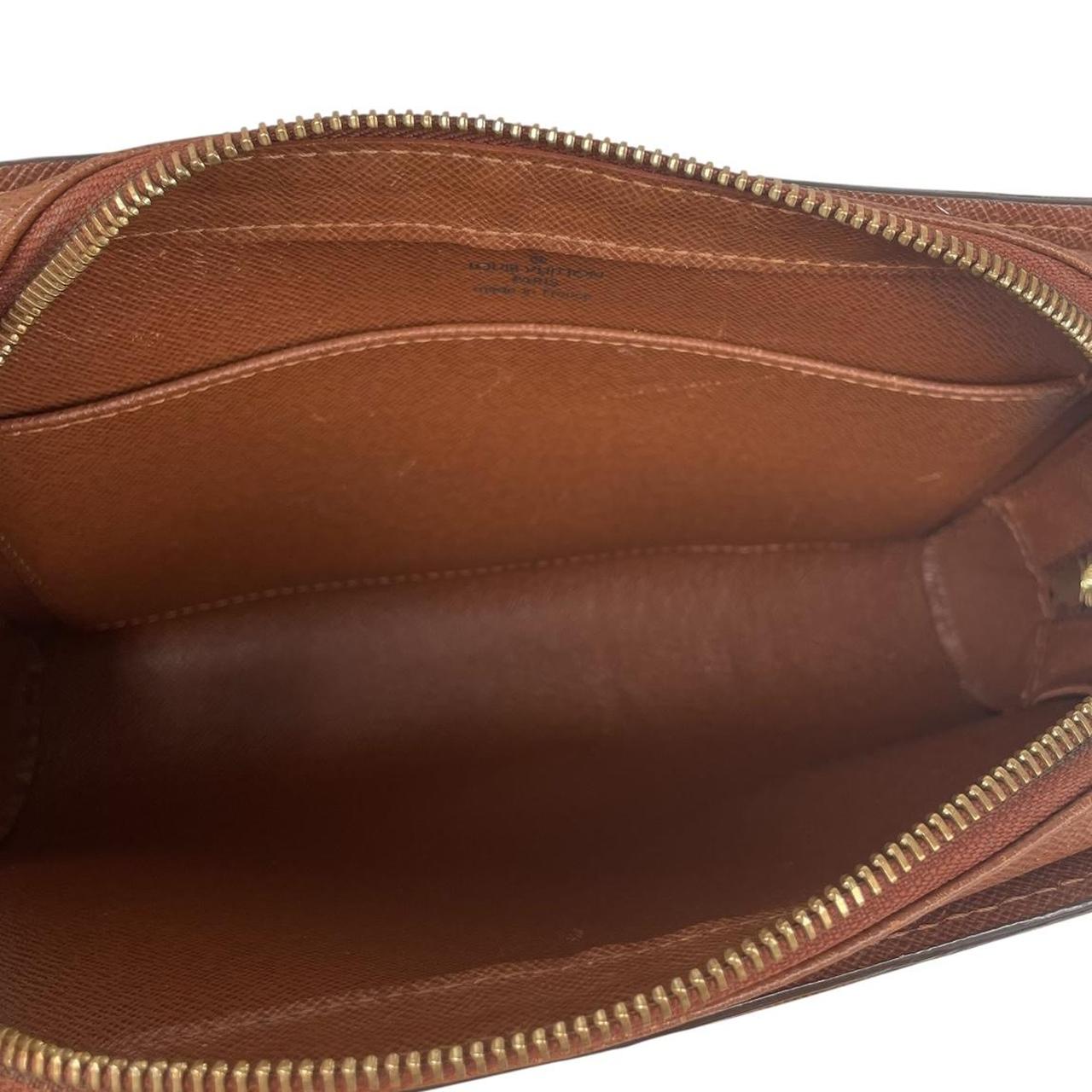 Louis Vuitton brown and tan monogram Orsay clutch bag with iconic logo pattern.