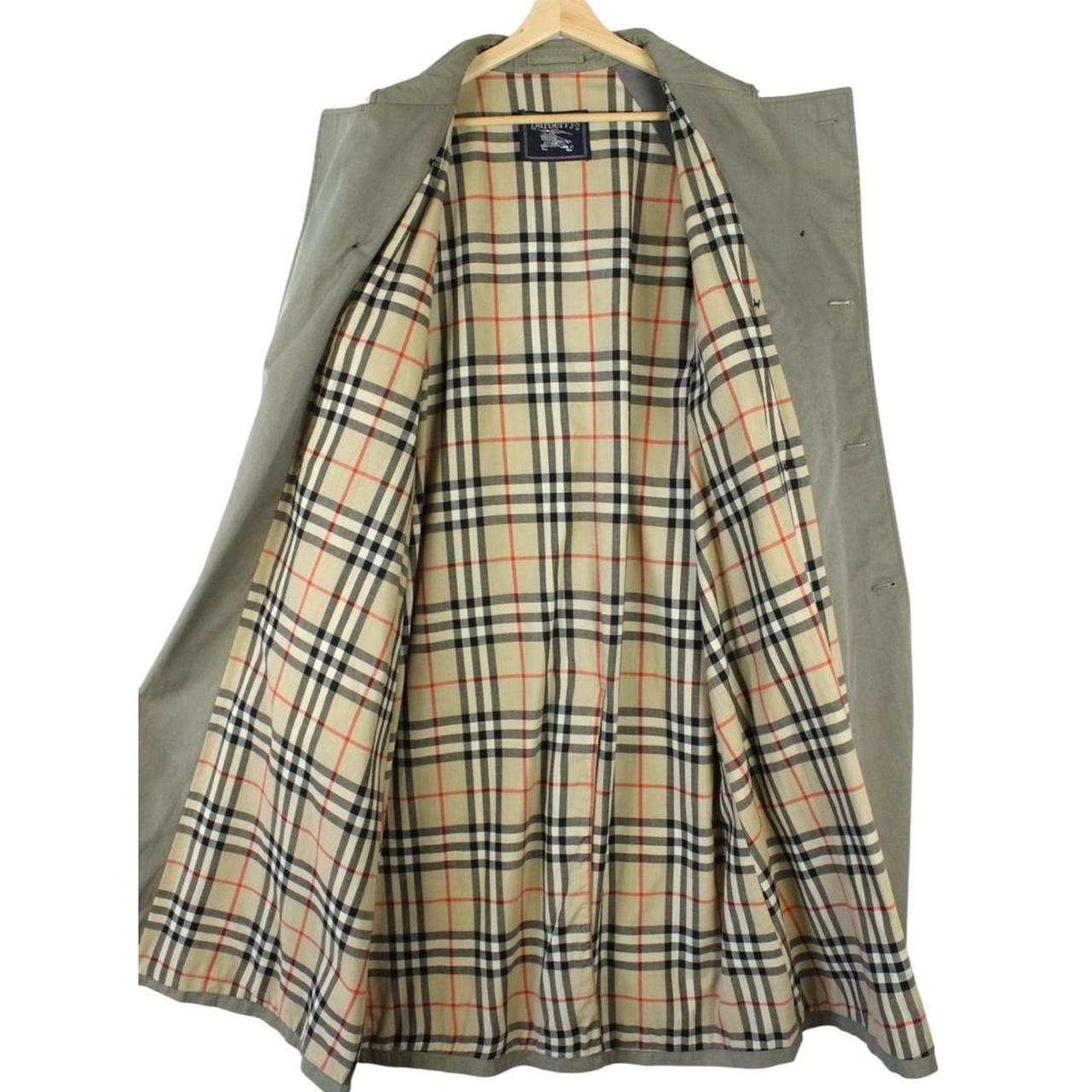Burberry khaki green trench coat featuring Nova Check pattern and double-breasted design.