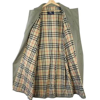 Burberry khaki green trench coat featuring Nova Check pattern and double-breasted design.