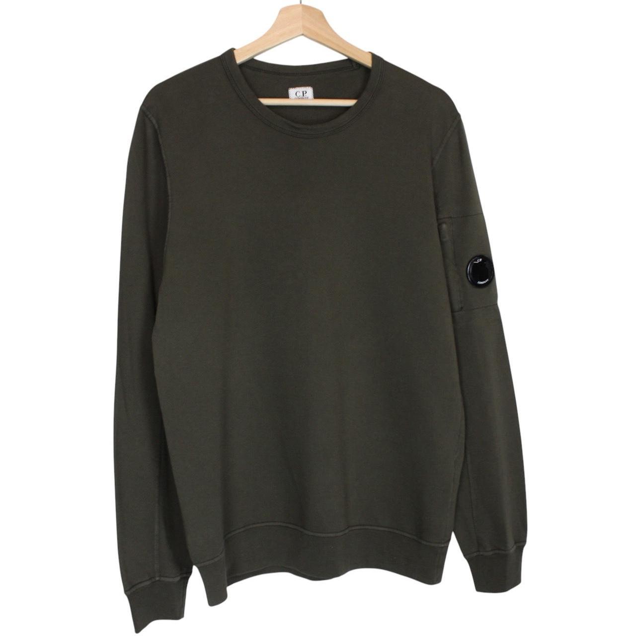 CP Company khaki green sweatshirt with goggle lens detail and cotton material.