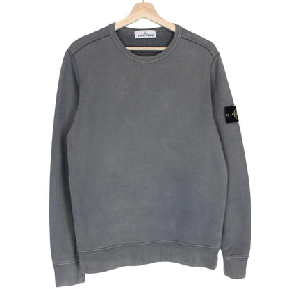 Stone Island grey cotton sweatshirt with embroidered compass logo and slight discolouration.