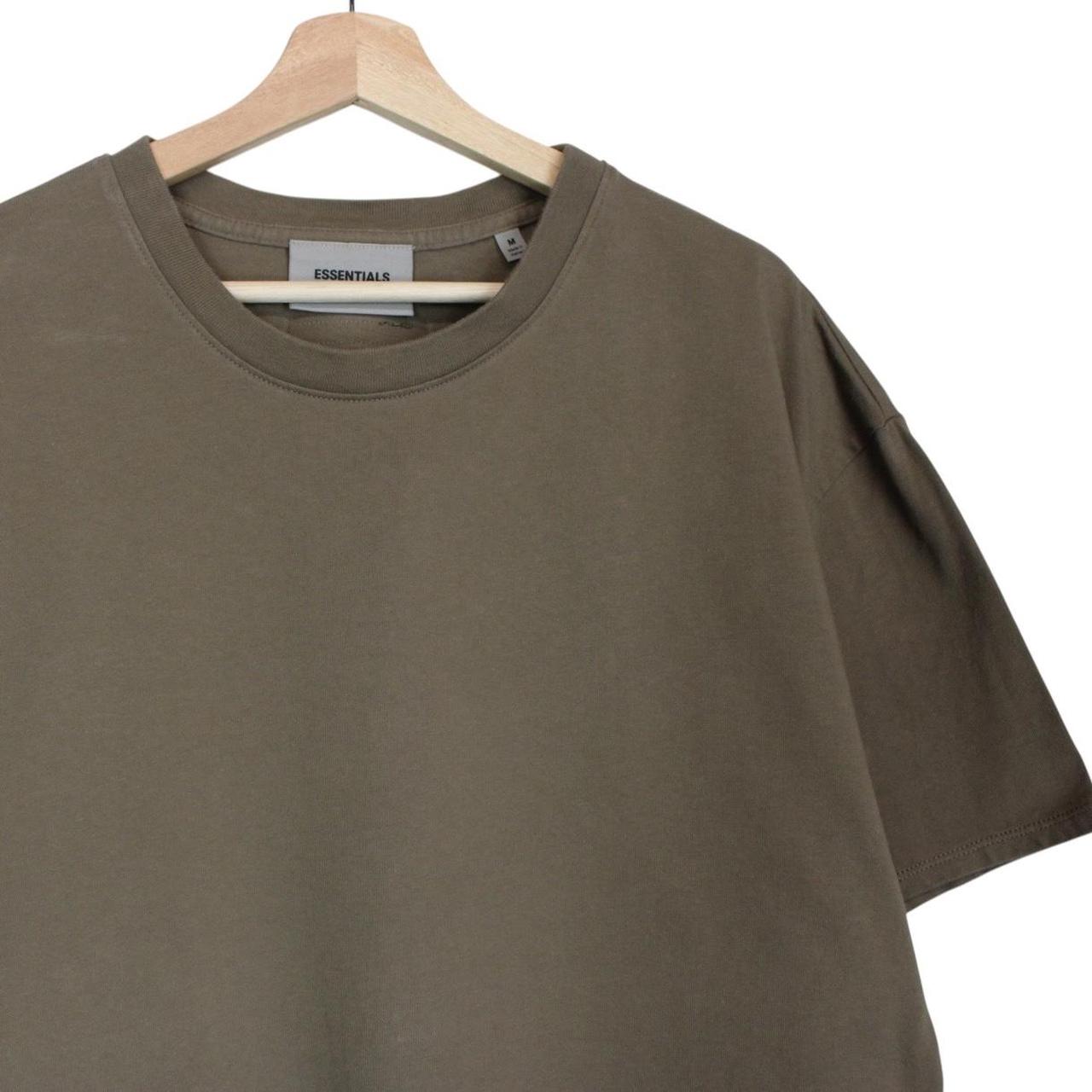 Essentials khaki brown short sleeve t-shirt with logo print and pocket detail.