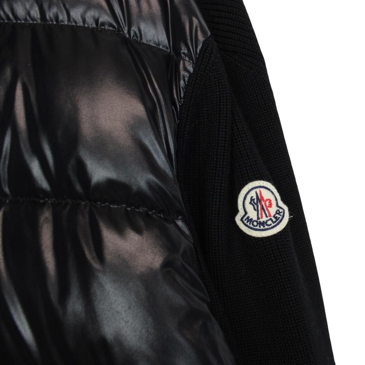 Moncler black cardigan jacket with full zip, wool/nylon blend, and logo detail.