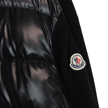 Moncler black cardigan jacket with full zip, wool/nylon blend, and logo detail.