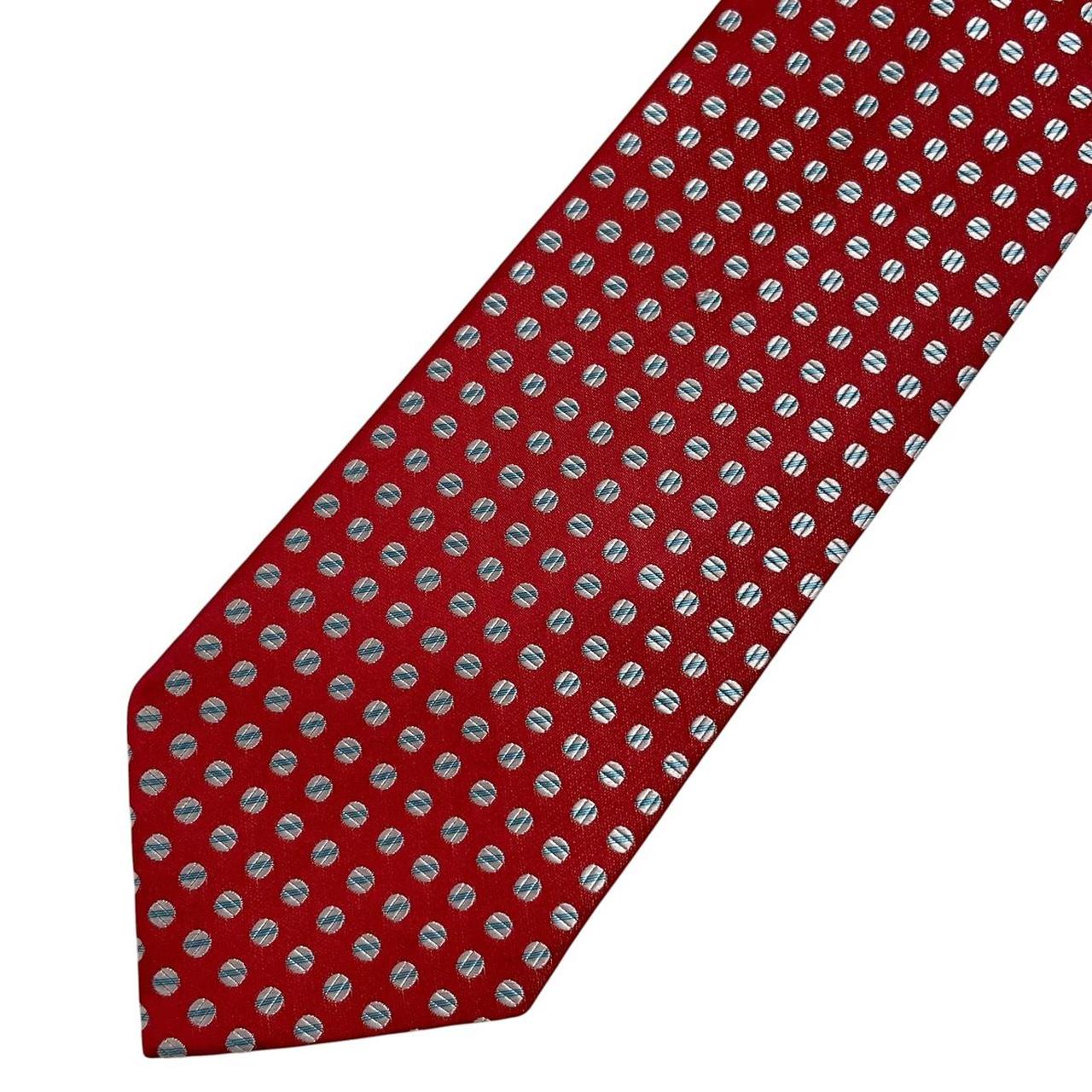 Aquascutum red silk tie with classic logo and smooth texture.