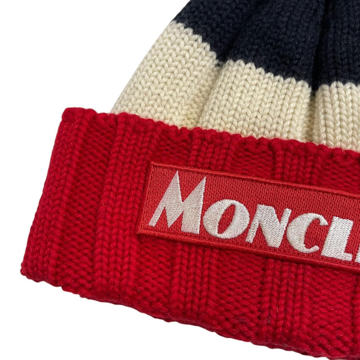 Moncler cream beanie hat with colour block design and embroidered logo.