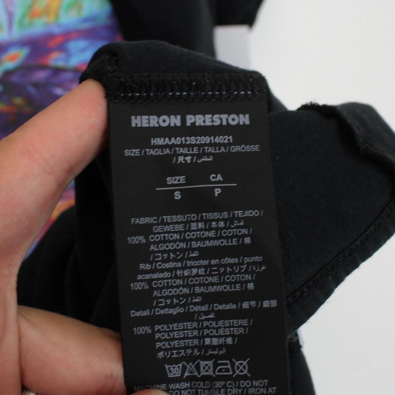 Heron Preston black pocket t-shirt with multicoloured birds print and oversized fit.