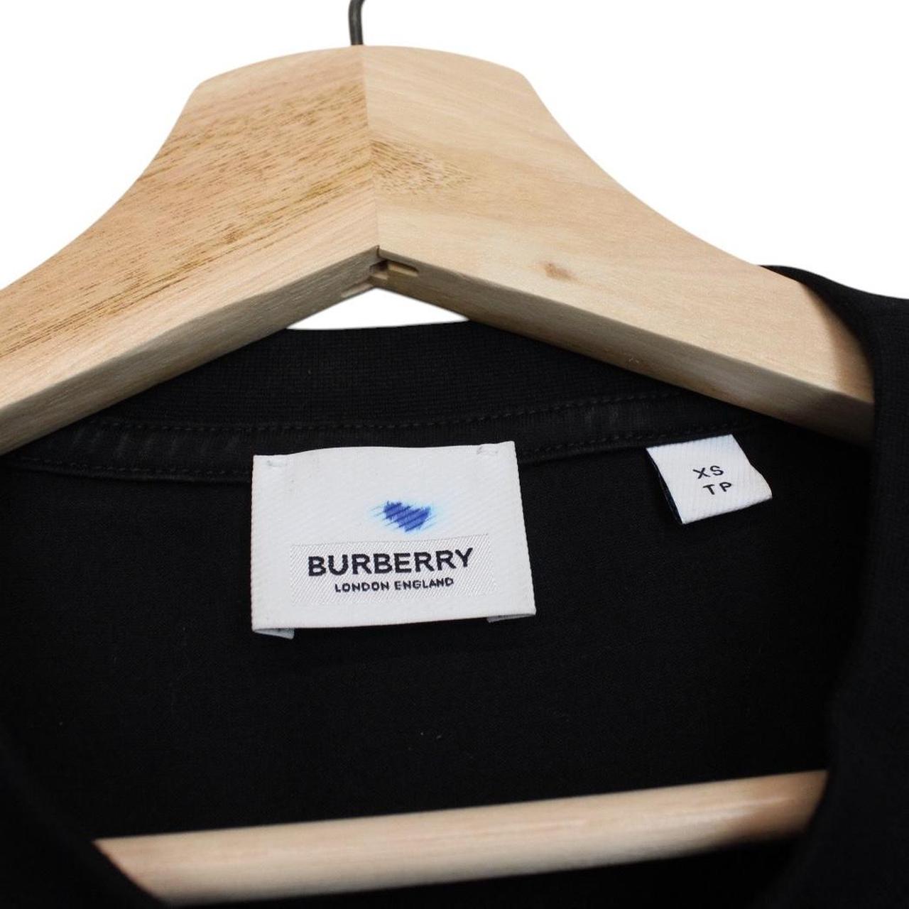 Burberry beige and black short sleeve t-shirt with Nova Check pattern and logo.