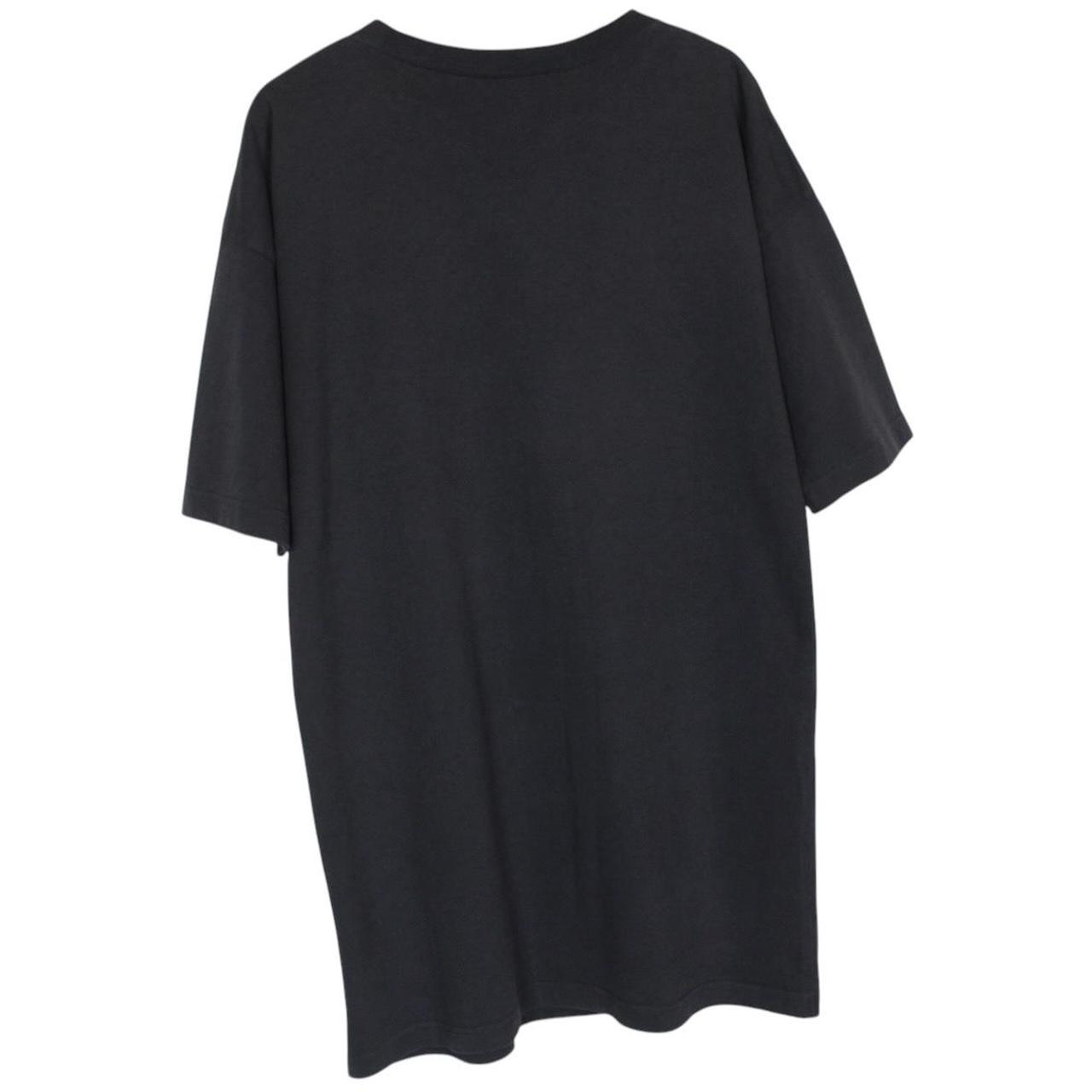 Balenciaga black oversized pocket t-shirt with bold logo print on front.