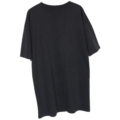 Balenciaga black oversized pocket t-shirt with bold logo print on front.