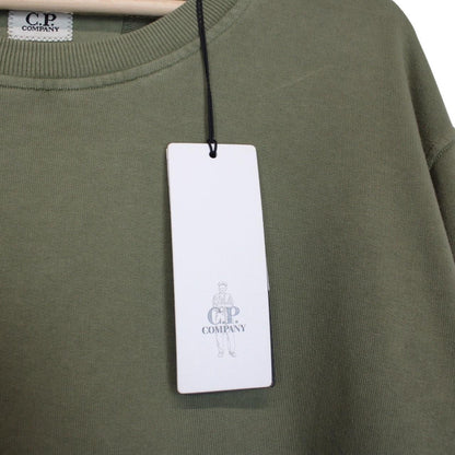 CP Company green sweatshirt diagonal fleece with signature lens detail and logo.