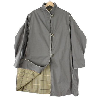 Burberry grey trench coat, single breasted, classic design, vintage 80s style.