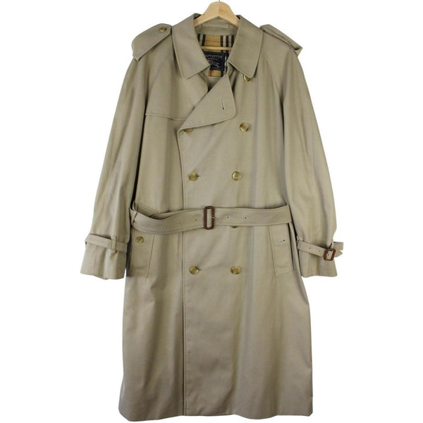 Burberry beige double-breasted belted trench coat with classic check lining and logo detail.