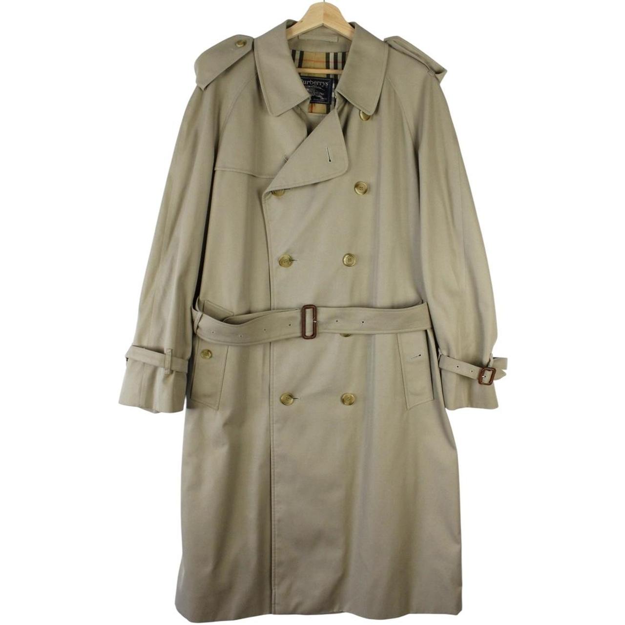 Burberry beige double-breasted belted trench coat with classic check lining and logo detail.