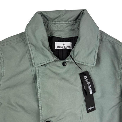 Stone Island green jacket with Primaloft insulation and iconic compass logo.