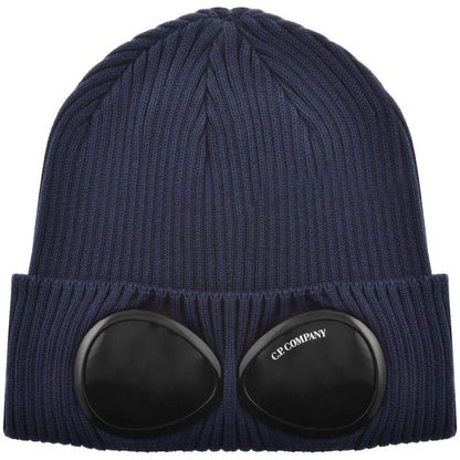 CP Company navy blue beanie hat with goggle detail and cotton material.