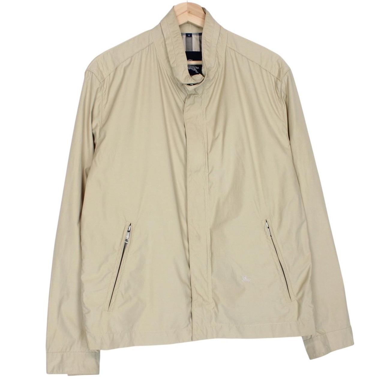 Burberry beige windbreaker jacket with full zip, logo detail, and nylon material.