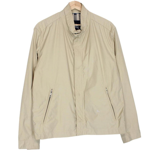 Burberry beige windbreaker jacket with full zip, logo detail, and nylon material.