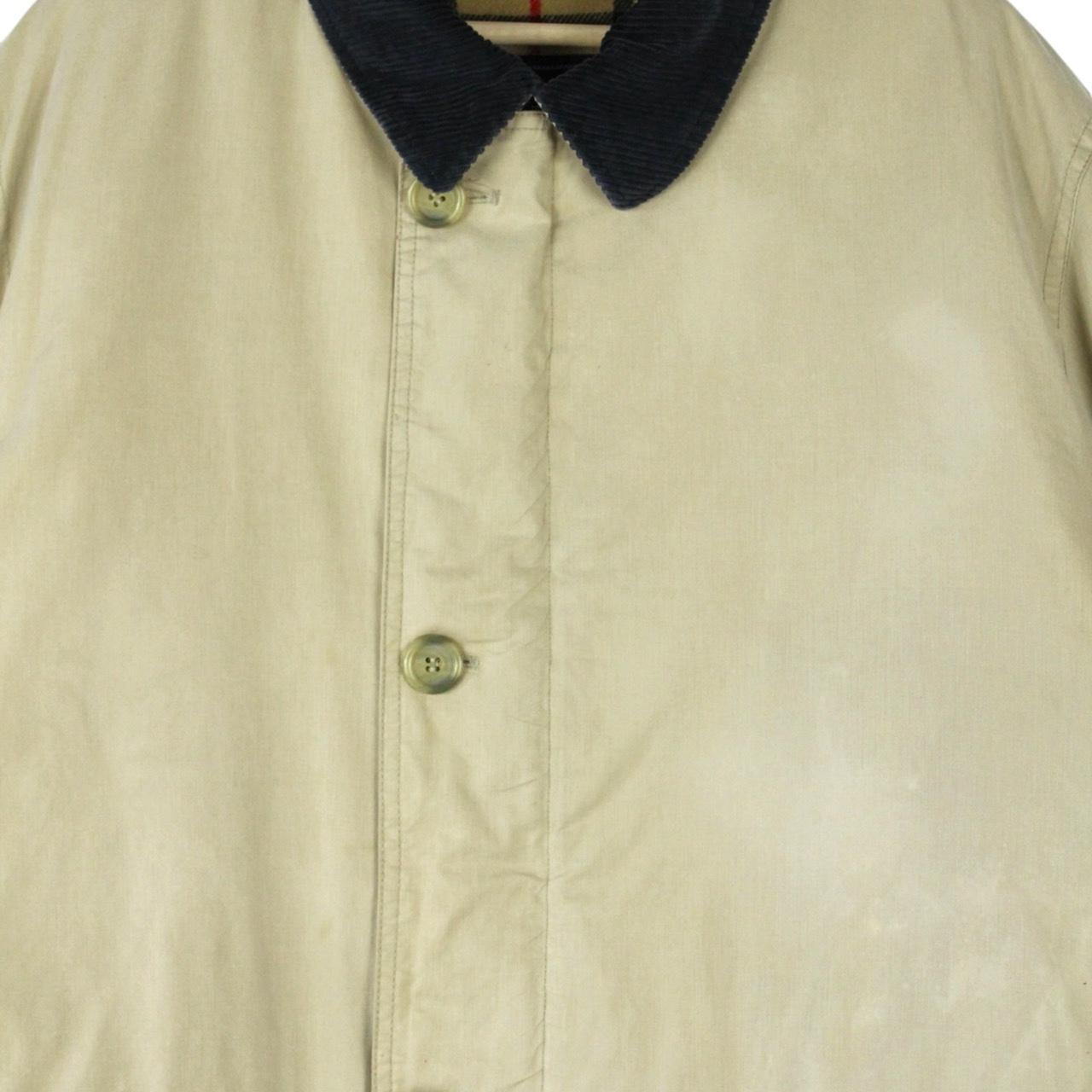 Burberry beige wool coat with Nova Check lining and logo detailing.