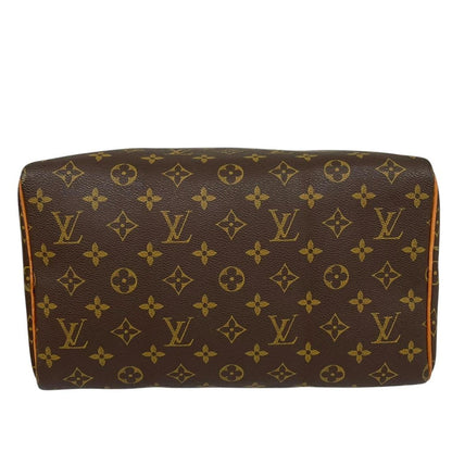 Louis Vuitton duffel bag beige and brown monogram coated canvas with leather trim.