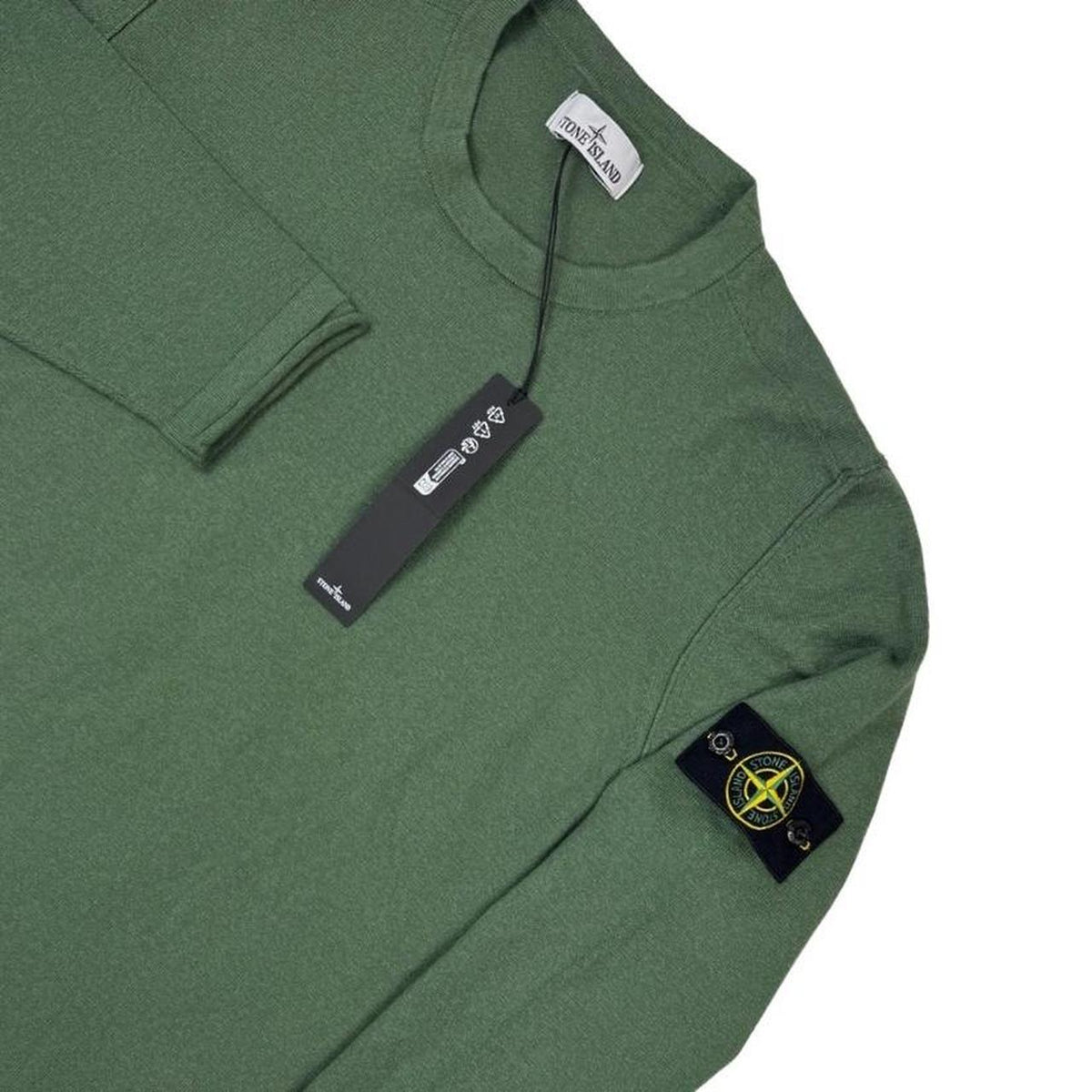 Stone Island green knit jumper made of organic cotton with logo patch.